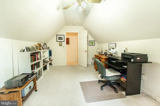 a view of a workspace with furniture