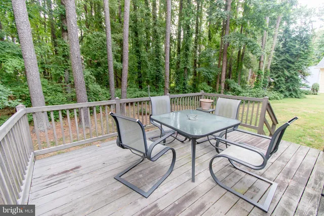 a view of a chairs and table on the deck