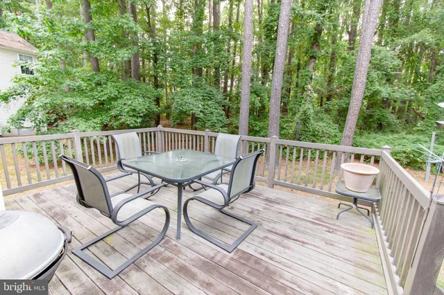 a view of a patio with a table and chairs