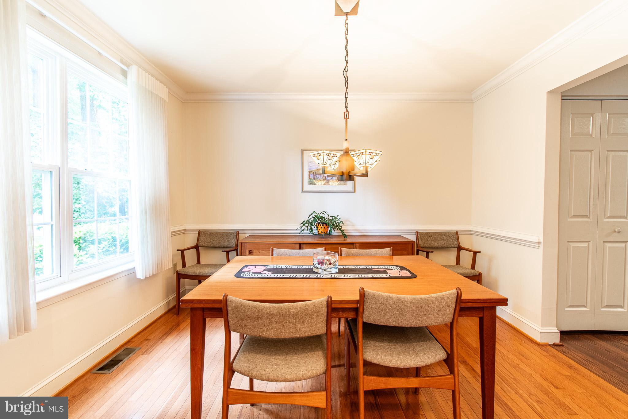 228 Tyler Avenue St. Michaels, MD 21663 - Photo 5 of 44 a view of a dining room with furniture window and wooden floor