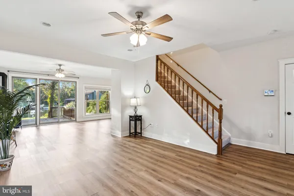 a view of an entryway with wooden floor