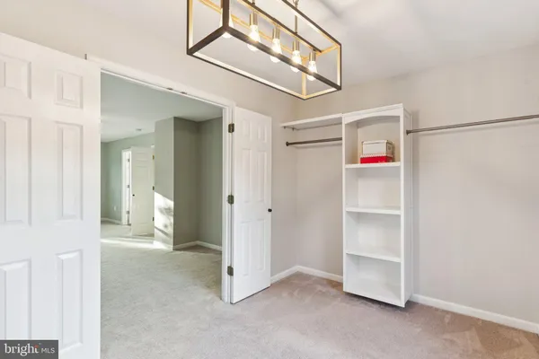 a view of a hallway with closet