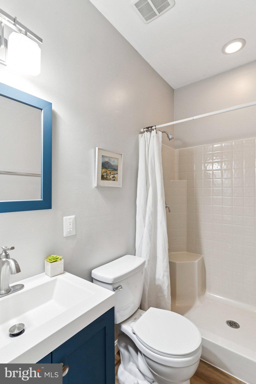 4922 Lerch Drive Shady Side, MD 20764 - Photo 28 of 56 a white toilet sitting next to a bathroom sink