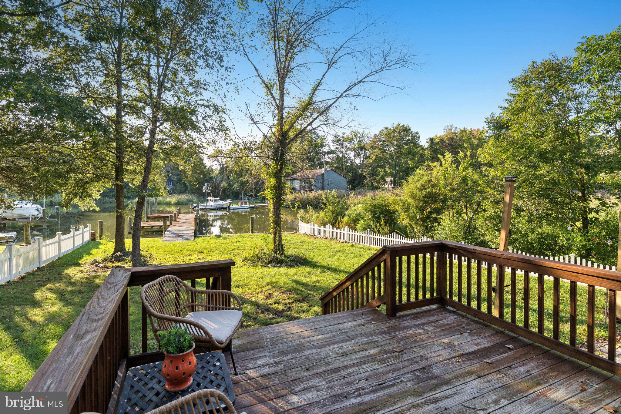 4922 Lerch Drive Shady Side, MD 20764 - Photo 29 of 56 a view of a roof deck with wooden floor and fence