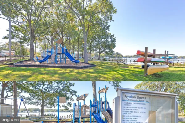 a view of swimming pool with lawn chairs and a yard