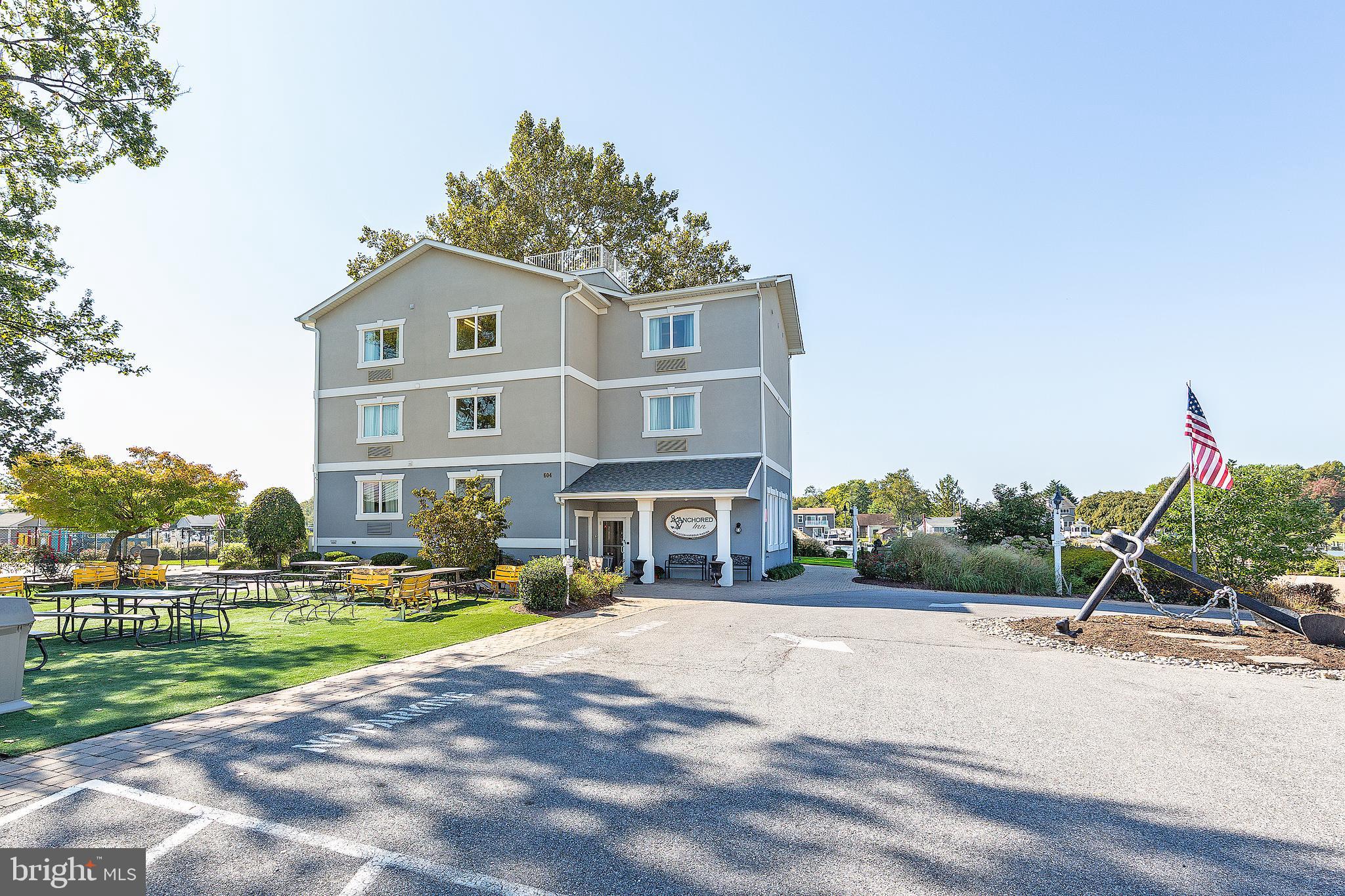 4922 Lerch Drive Shady Side, MD 20764 - Photo 39 of 56 a front view of a house with a yard