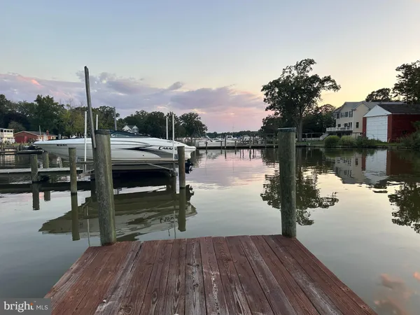 a view of a wooden deck and a yard