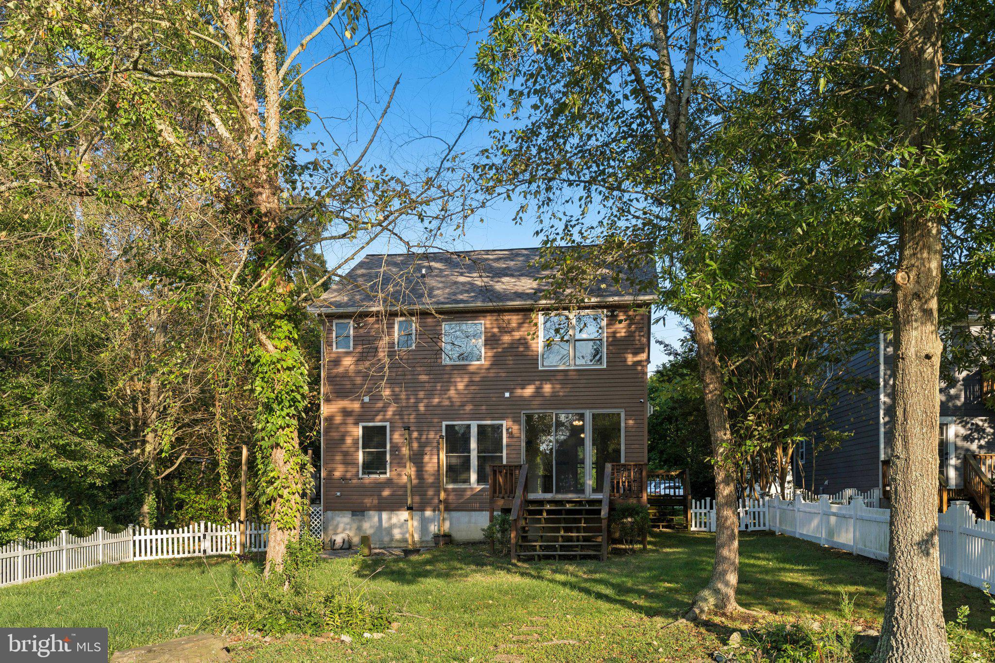 4922 Lerch Drive Shady Side, MD 20764 - Photo 52 of 56 a front view of a house with a yard