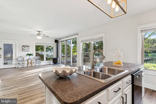 a kitchen with granite countertop a sink and a counter top space