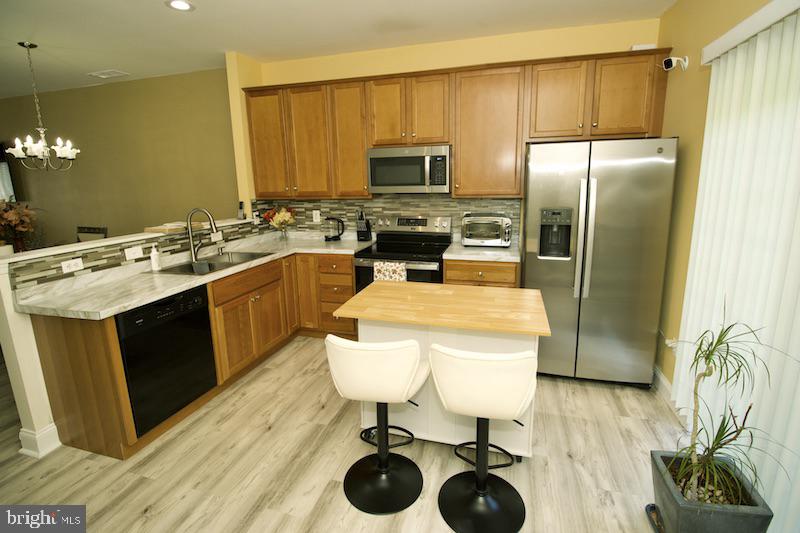162 Lexington Place Dover, DE 19901 - Photo 16 of 48 a kitchen with a sink appliances and cabinets