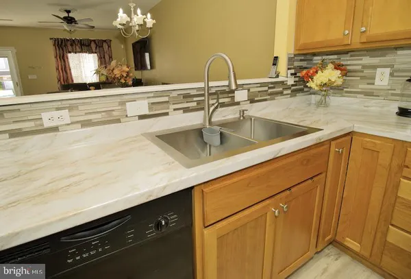 a kitchen with sink and cabinets