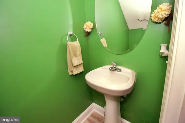 a bathroom with a sink and mirror