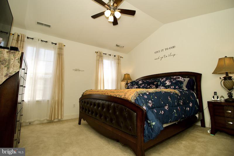 162 Lexington Place Dover, DE 19901 - Photo 23 of 48 a bedroom with a bed lamp and a fireplace