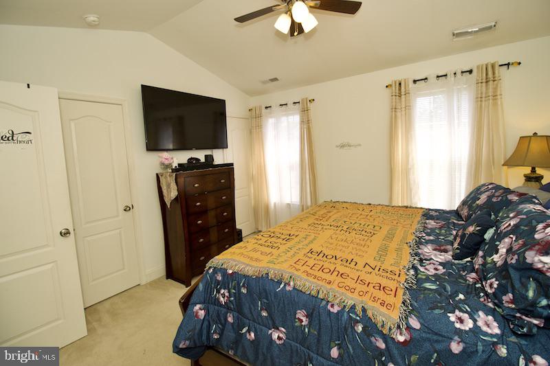162 Lexington Place Dover, DE 19901 - Photo 24 of 48 a bedroom with a bed and a flat screen tv