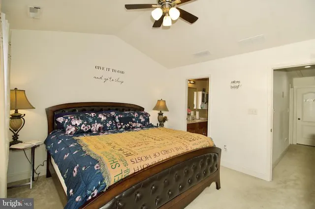 a bedroom with a bed and cabinet