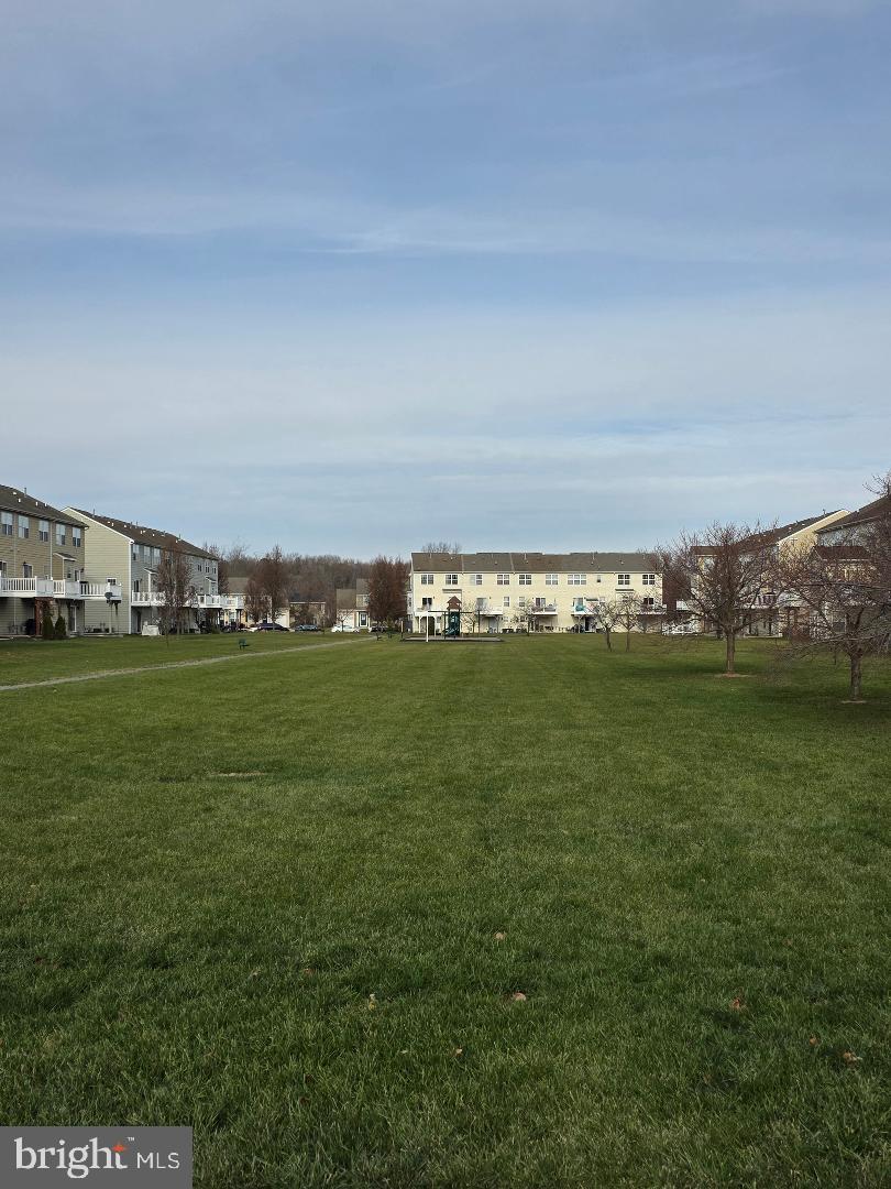 162 Lexington Place Dover, DE 19901 - Photo 47 of 48 a view of a field with houses in the background
