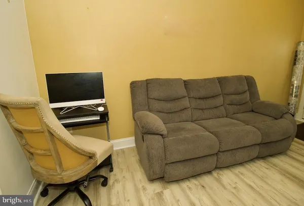 a living room with a couch and a flat screen tv