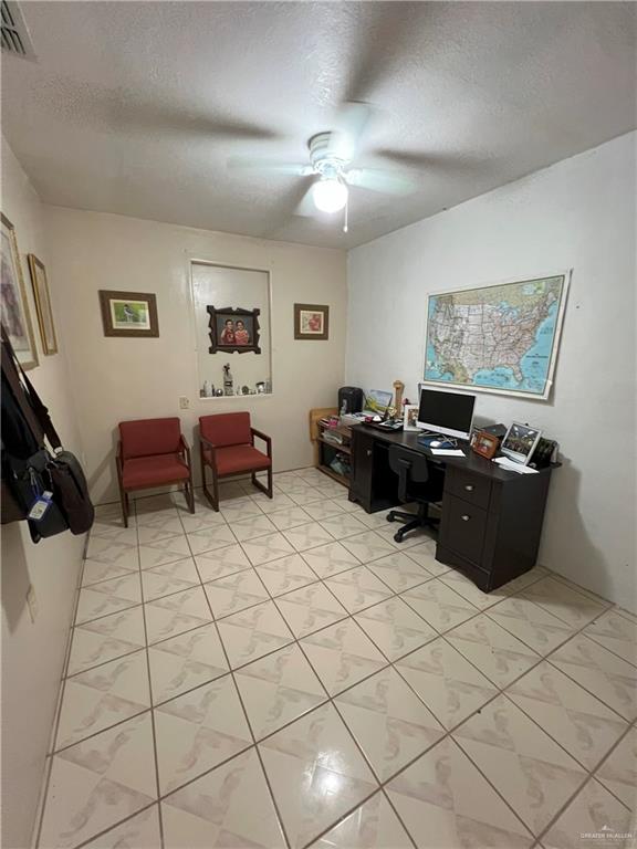414 Mockingbird Lane Mercedes, TX 78570 - Photo 12 of 27 a living room with furniture and a flat screen tv