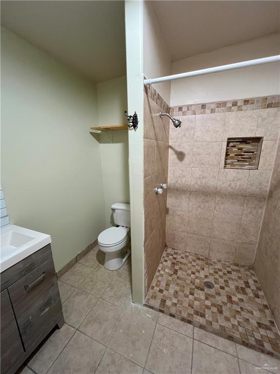 414 Mockingbird Lane Mercedes, TX 78570 - Photo 20 of 27 a bathroom with a granite countertop shower and a toilet