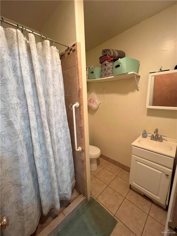 414 Mockingbird Lane Mercedes, TX 78570 - Photo 23 of 27 a bathroom with a sink toilet and shower