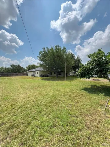 a view of a lake with a big yard