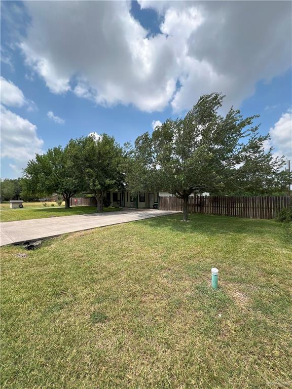 414 Mockingbird Lane Mercedes, TX 78570 - Photo 3 of 27 a view of a swimming pool with a yard