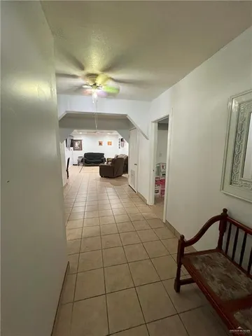 a view of an empty room and a window