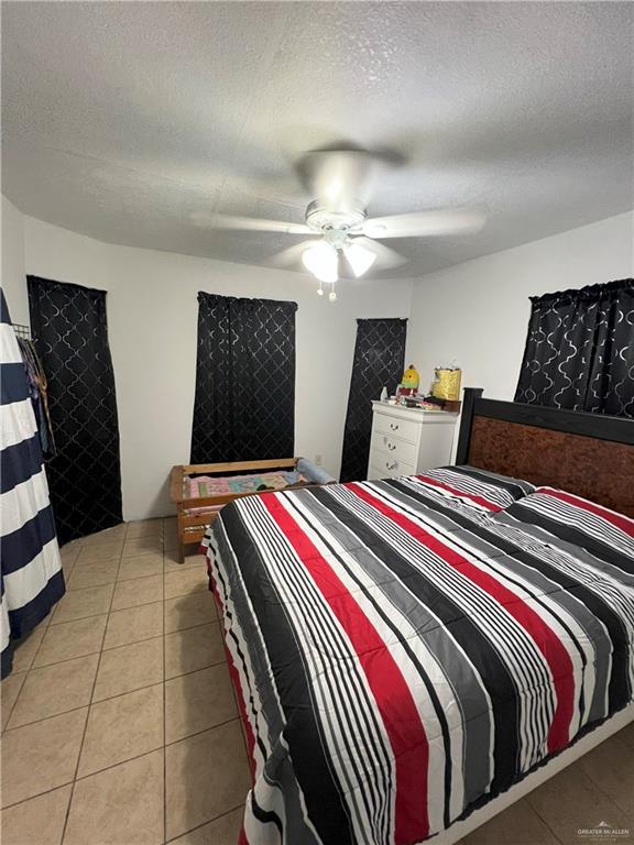 414 Mockingbird Lane Mercedes, TX 78570 - Photo 8 of 27 a bedroom with bed and balcony