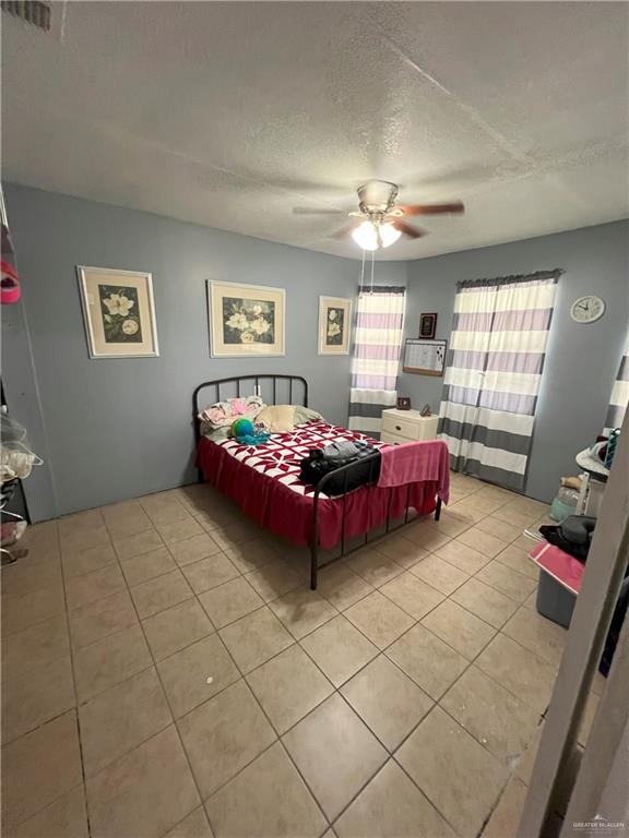 414 Mockingbird Lane Mercedes, TX 78570 - Photo 10 of 27 a bedroom with furniture and window