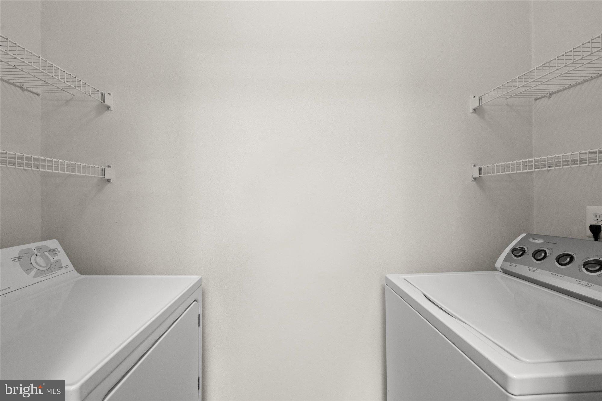 1571 Spring Gate Dr., Unit 6213 McLean, VA 22102 - Photo 7 of 39 a utility room with dryer and washer