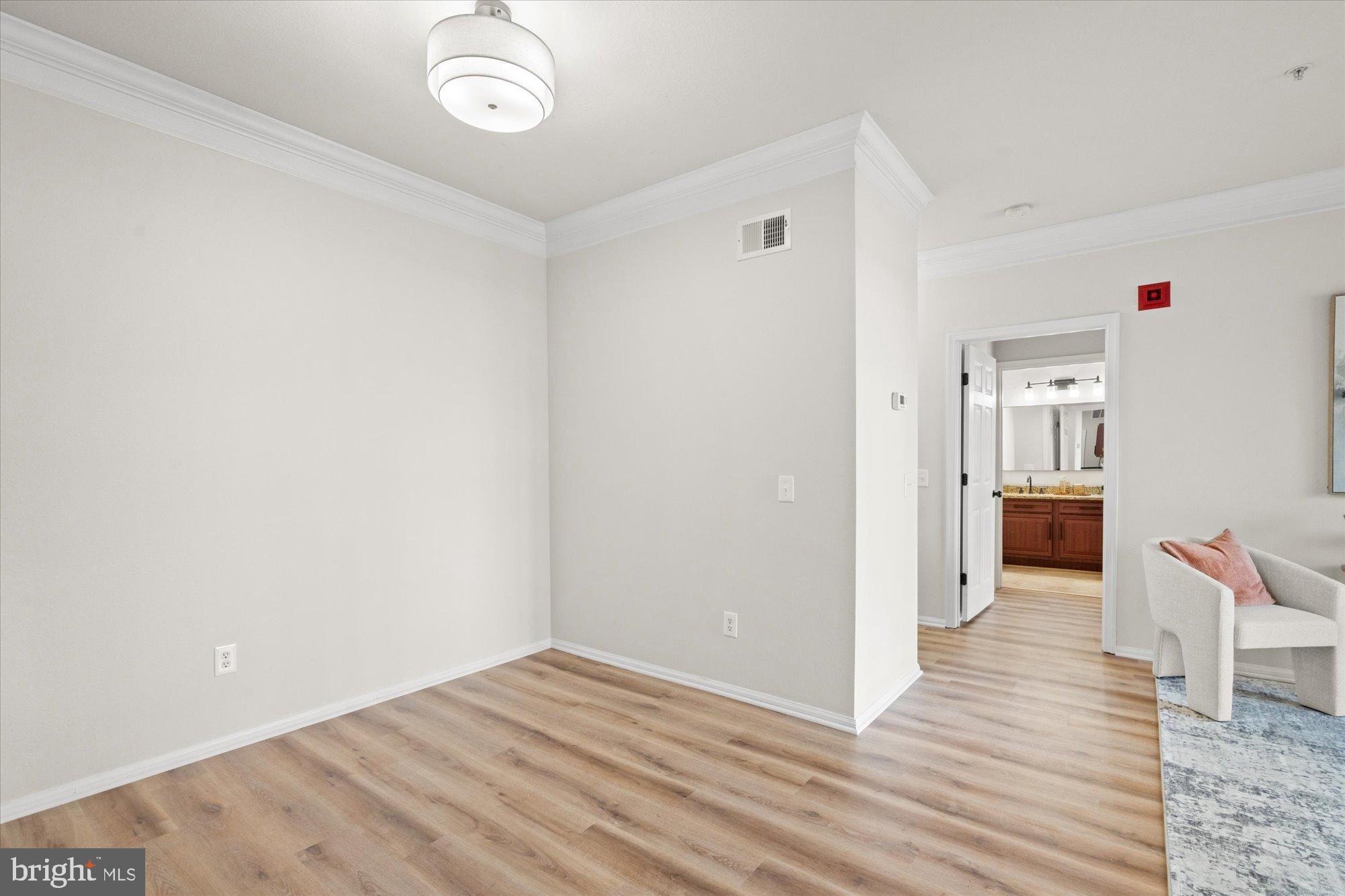 1571 Spring Gate Dr., Unit 6213 McLean, VA 22102 - Photo 9 of 39 a view of a hallway with wooden floor