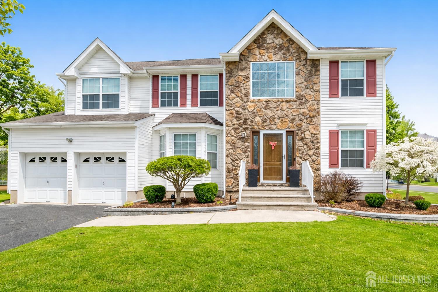 22 Ginger Drive Edison, NJ 08837 - Photo 1 of 41 a front view of a house with a yard and garage