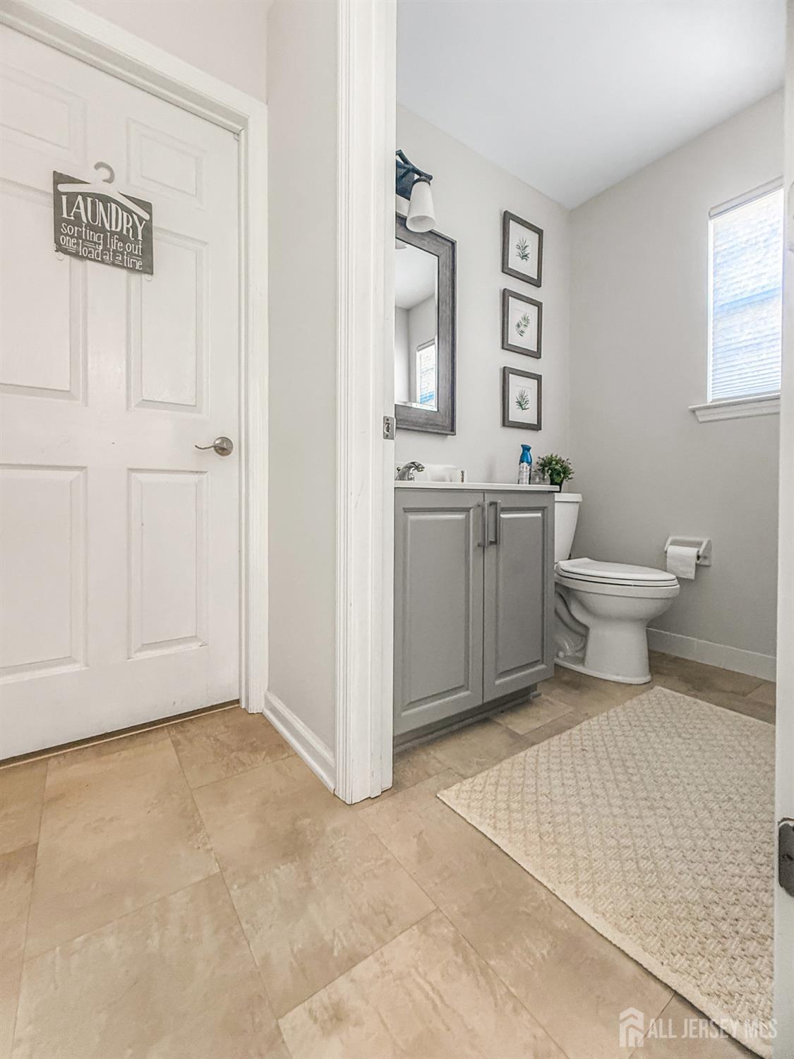 22 Ginger Drive Edison, NJ 08837 - Photo 12 of 41 a bathroom with a toilet a sink and mirror