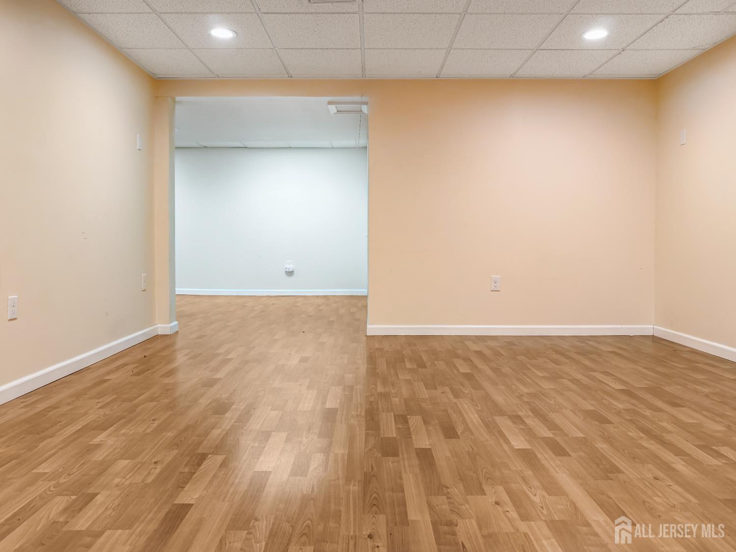 22 Ginger Drive Edison, NJ 08837 - Photo 30 of 41 a view of an empty room with wooden floor