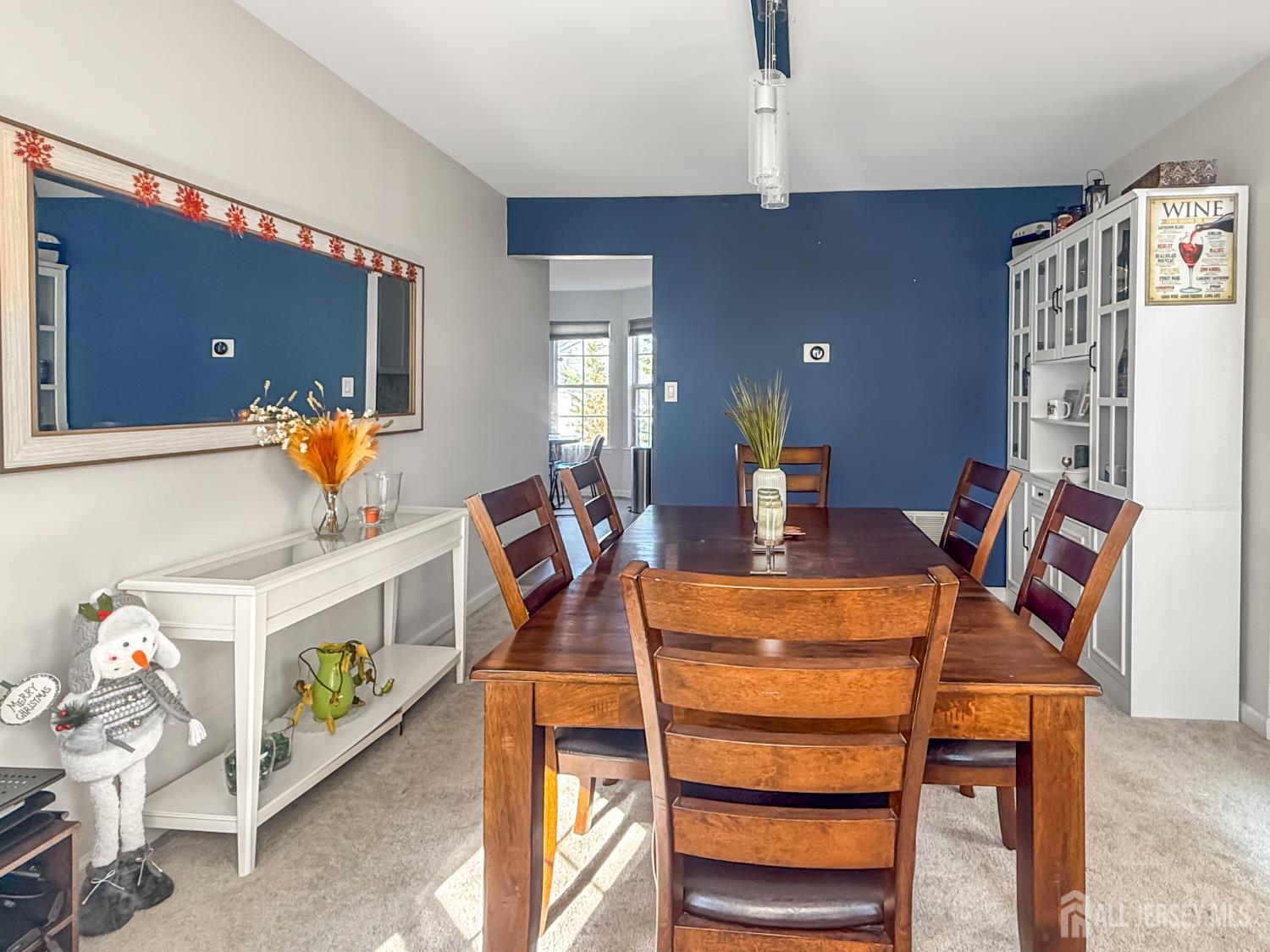 22 Ginger Drive Edison, NJ 08837 - Photo 8 of 41 a living room with a couch and a dining table