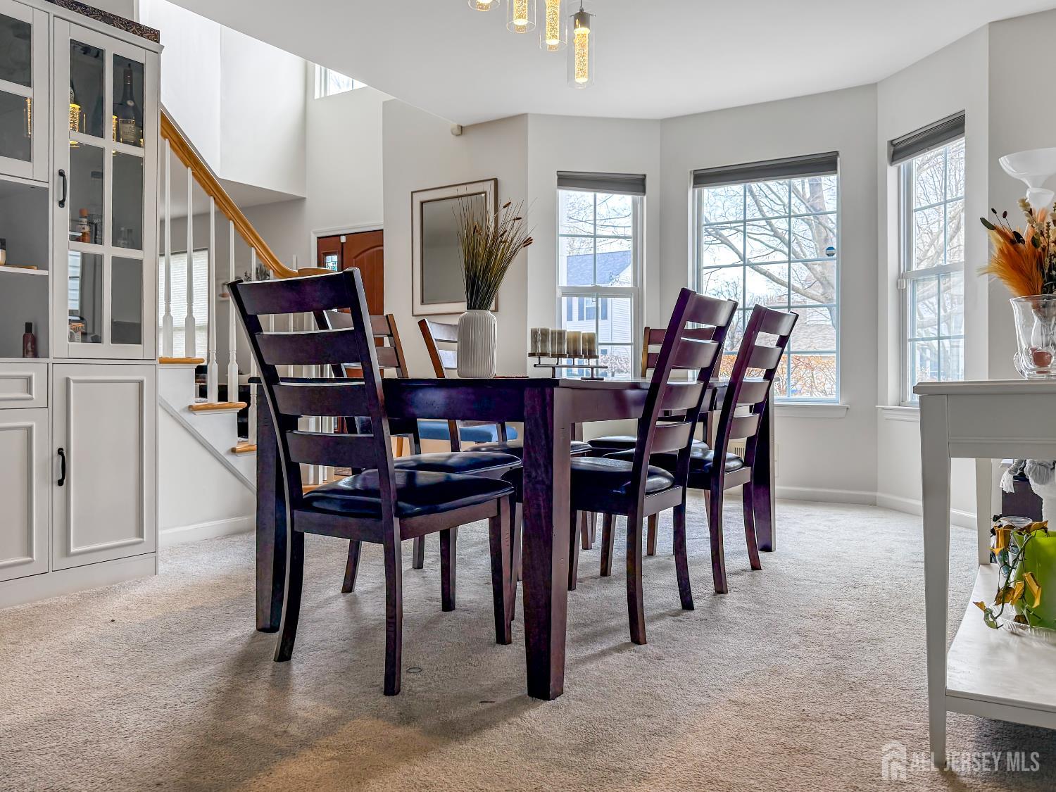 22 Ginger Drive Edison, NJ 08837 - Photo 9 of 41 a view of a dining room with furniture and a potted plant