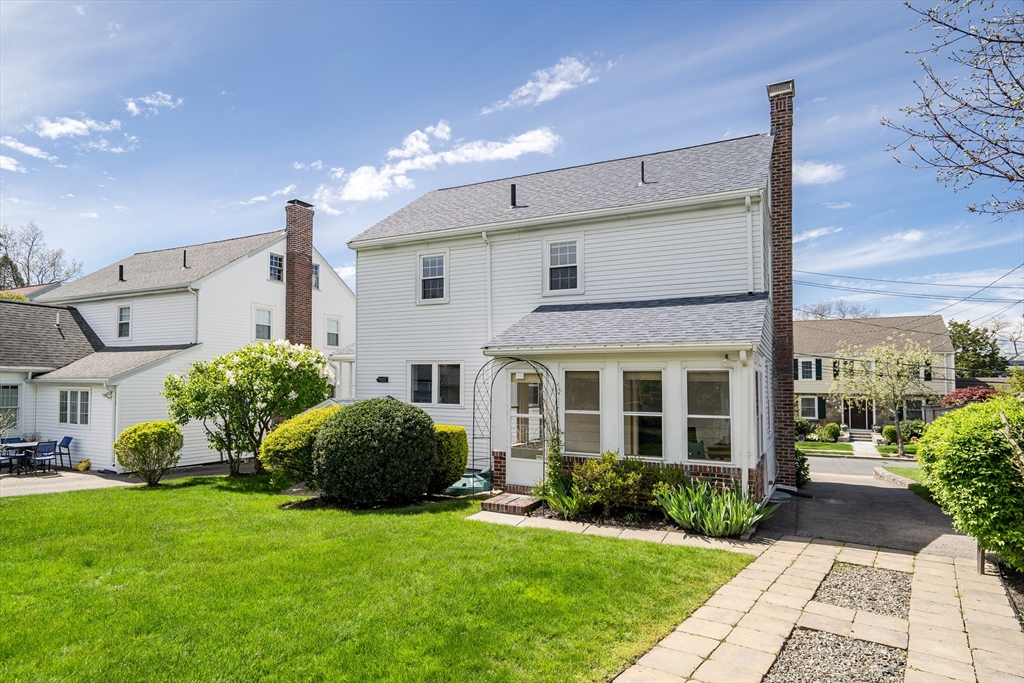 70 Howitt Road Boston, MA 02132 - Photo 25 of 30 a front view of a house with garden