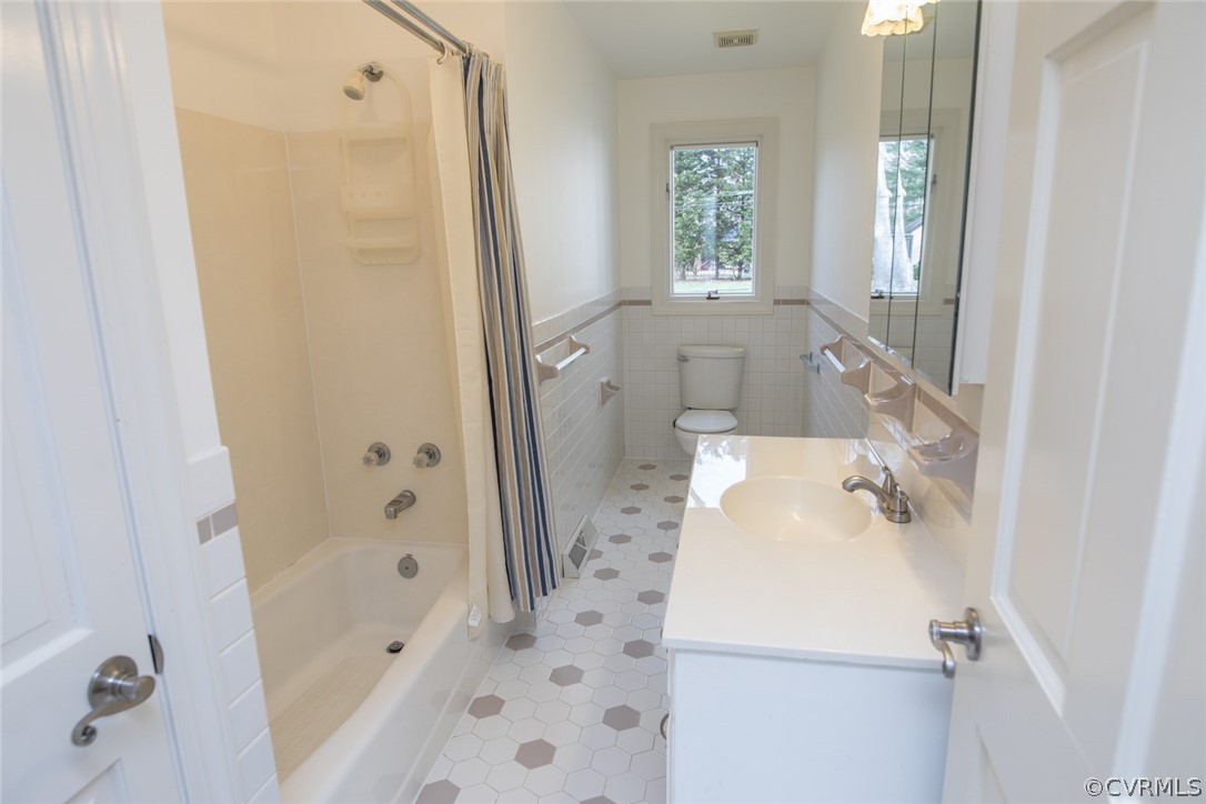 9950 Lumlay Road Chesterfield, VA 23236 - Photo 27 of 41 a bathroom with a sink a window and shower