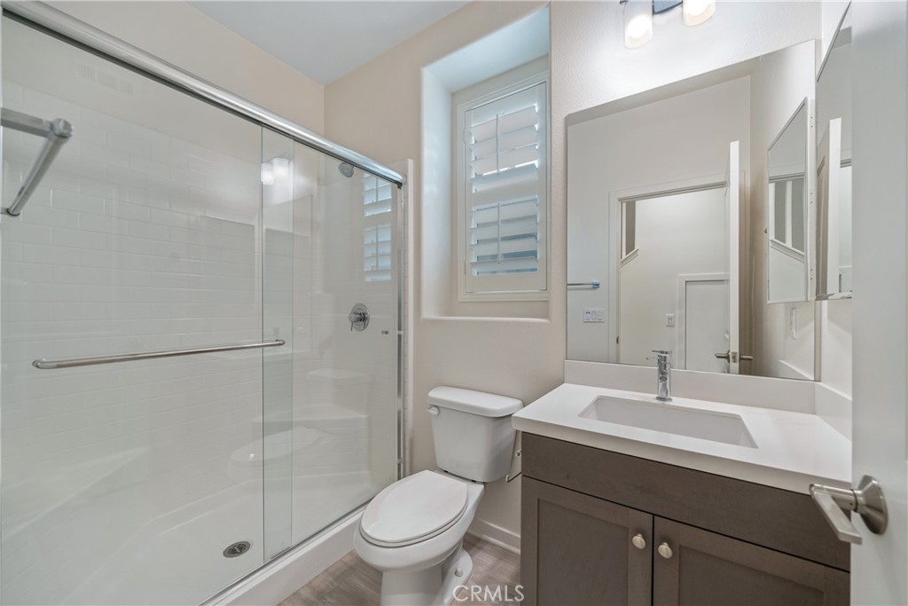 11082 Panoramic Drive Rancho Cucamonga, CA 91730 - Photo 11 of 48 a bathroom with a sink toilet and shower