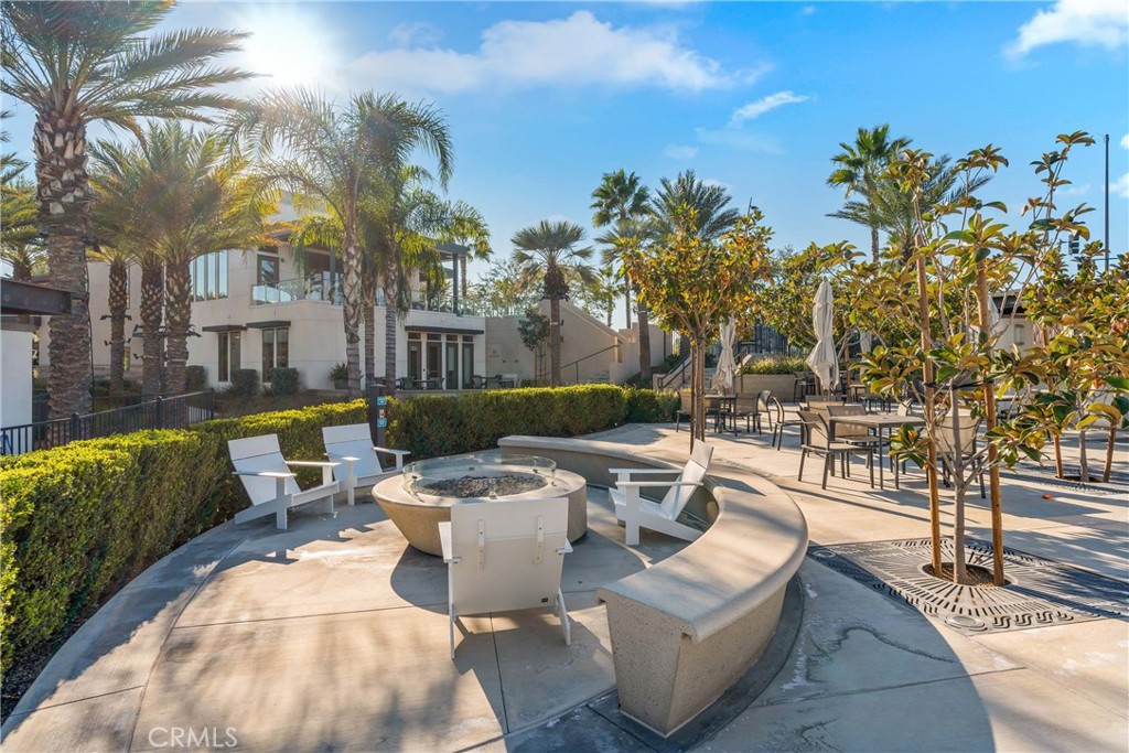 11082 Panoramic Drive Rancho Cucamonga, CA 91730 - Photo 40 of 48 a view of a patio with couches and chairs with plants and palm trees