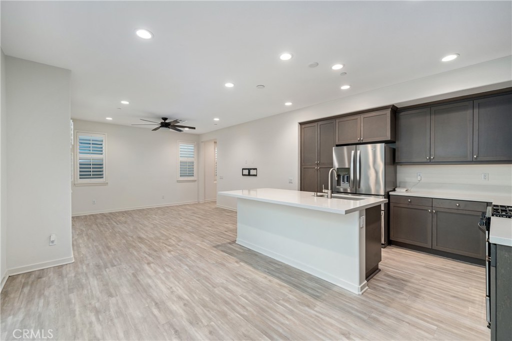 11082 Panoramic Drive Rancho Cucamonga, CA 91730 - Photo 5 of 48 a kitchen with stainless steel appliances a refrigerator and a stove top oven