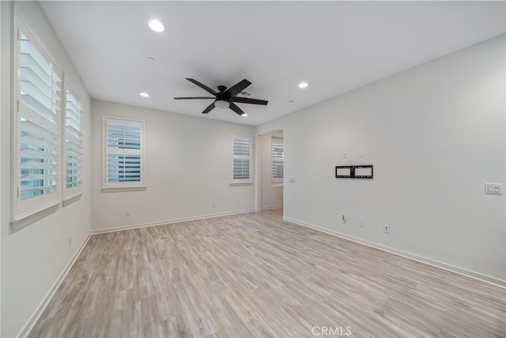 11082 Panoramic Drive Rancho Cucamonga, CA 91730 - Photo 8 of 48 a view of a big room with wooden floor and windows
