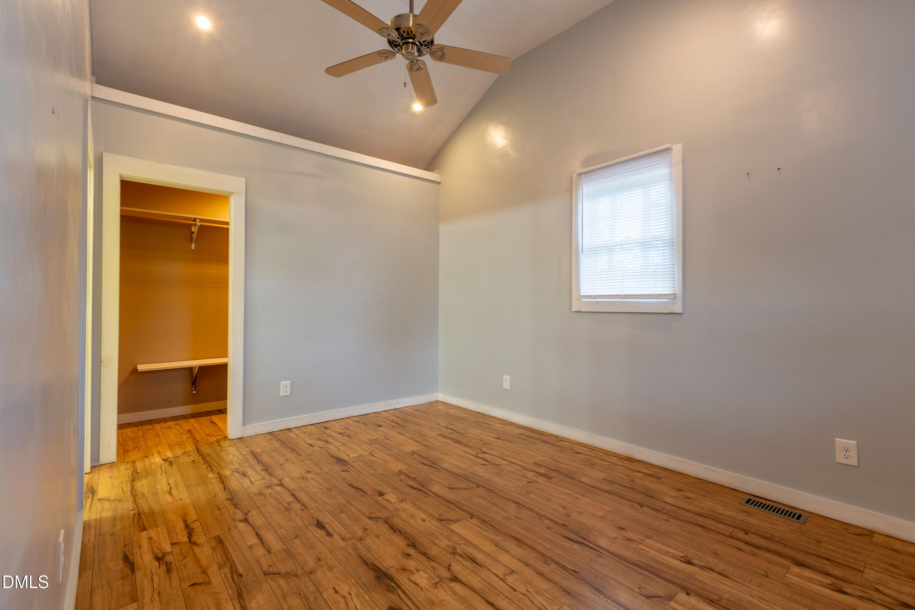 4295 Virgilina Road Roxboro, NC 27574 - Photo 20 of 46 an empty room with wooden floor closet and windows