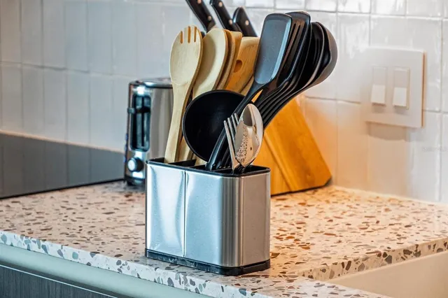 a bedroom with a large bed and a balcony view