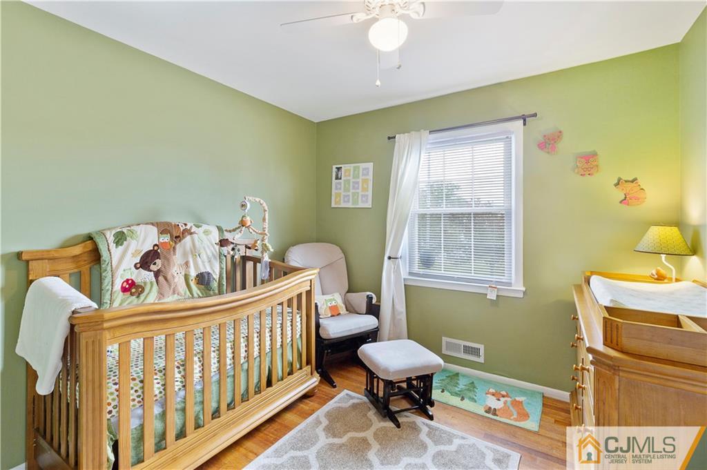 63 Daniel Street Carteret, NJ 07008 - Photo 11 of 20 a bedroom with a bed and a window