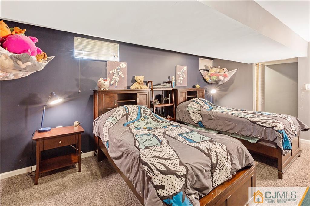 63 Daniel Street Carteret, NJ 07008 - Photo 16 of 20 a bedroom with bed and a window