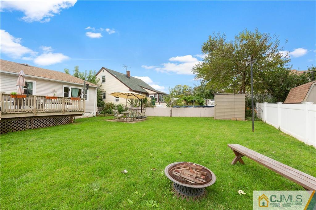 63 Daniel Street Carteret, NJ 07008 - Photo 17 of 20 a view of a house with backyard and sitting area