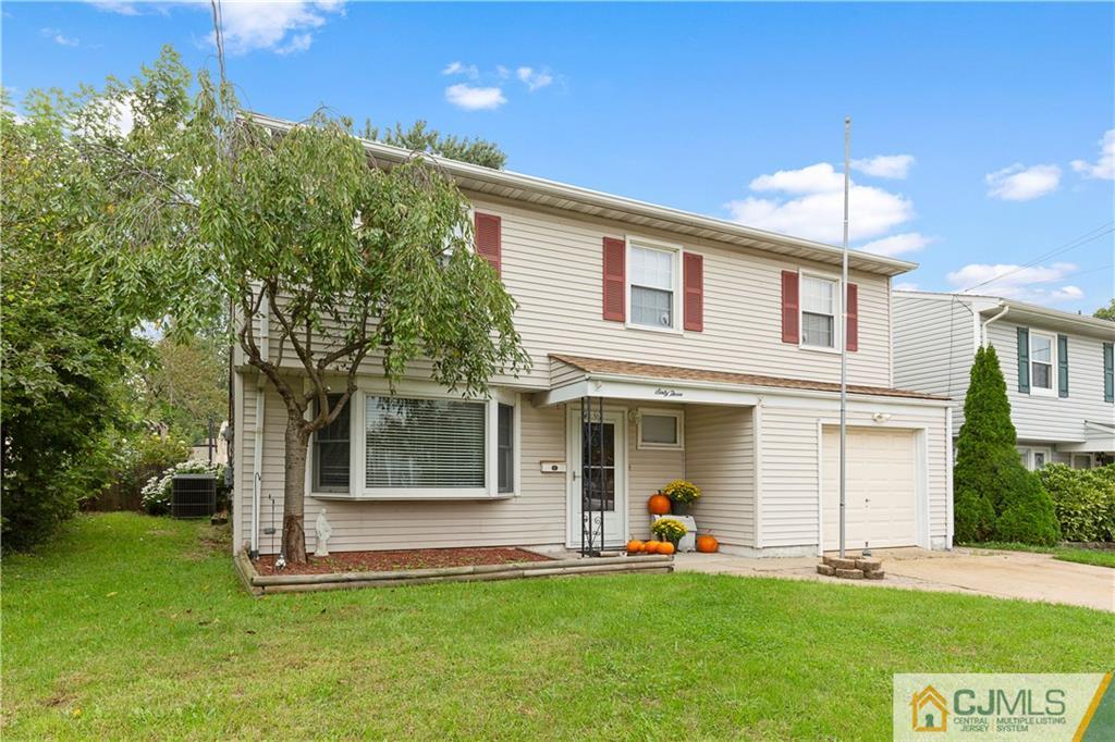 63 Daniel Street Carteret, NJ 07008 - Photo 19 of 20 front view of a house with a yard