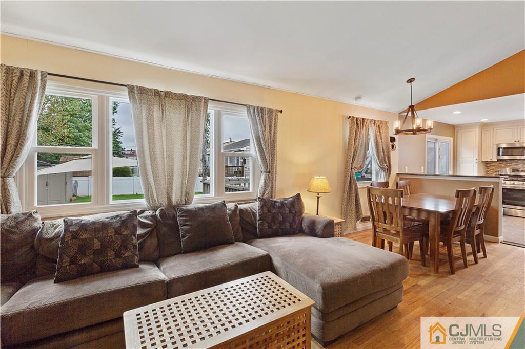 63 Daniel Street Carteret, NJ 07008 - Photo 5 of 20 a living room with furniture and a large window