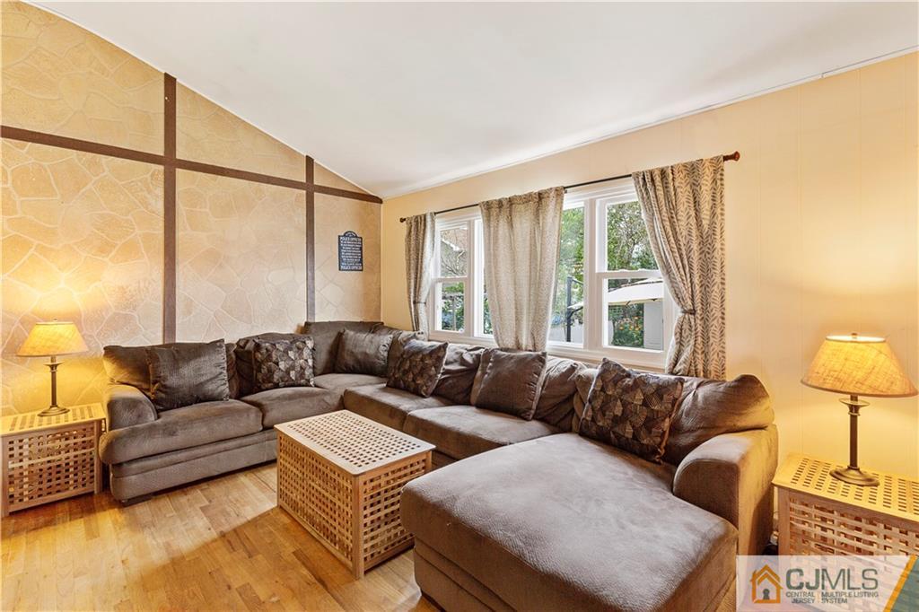 63 Daniel Street Carteret, NJ 07008 - Photo 6 of 20 a living room with furniture and a large window